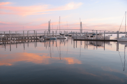 Charleston Harbor at sunrise. Photo via.